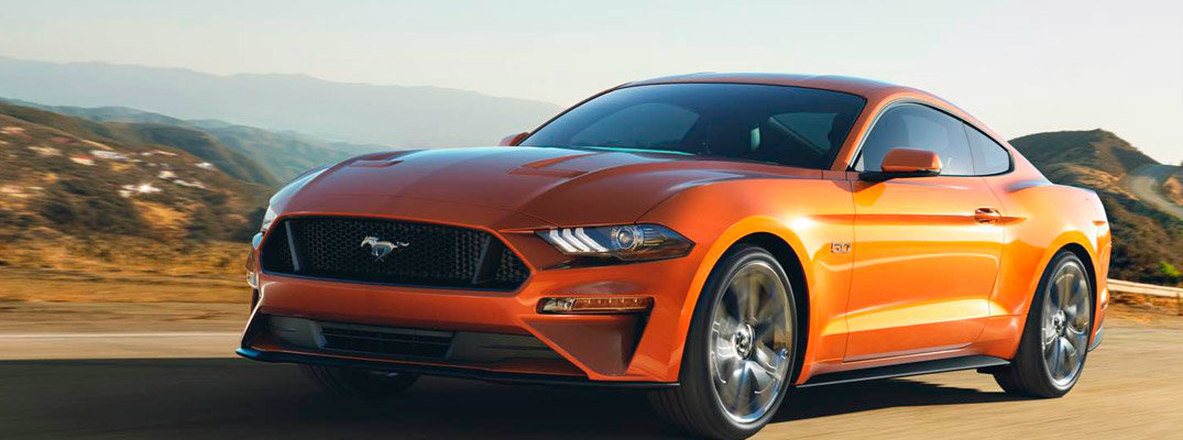 Orange 2018 Ford Mustang Driving on Highway