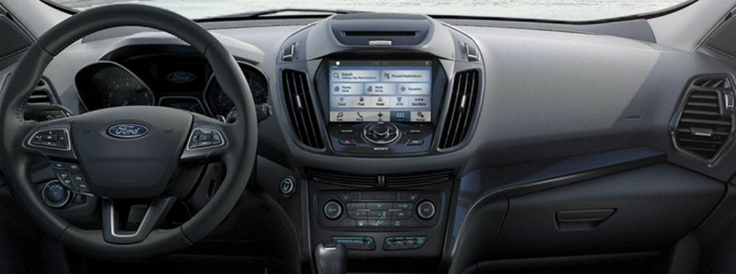 Steering wheel and dashboard of Ford SUV to illustrate new tech features
