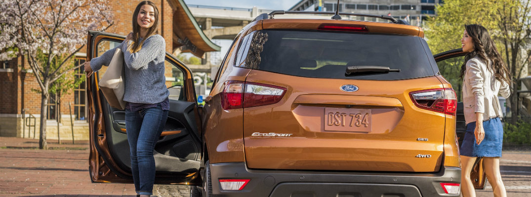Two girls exiting 2018 Ford EcoSport in daytime