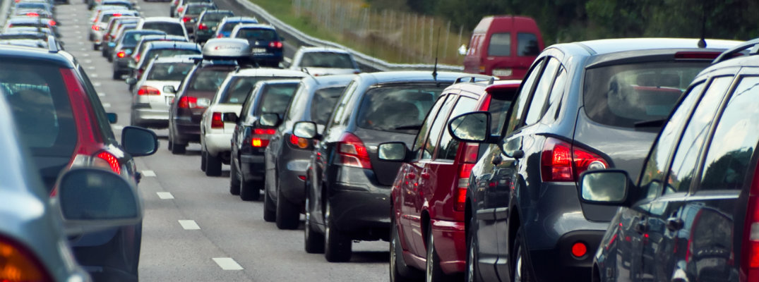 Rows of vehicles stuck in highway traffic jam
