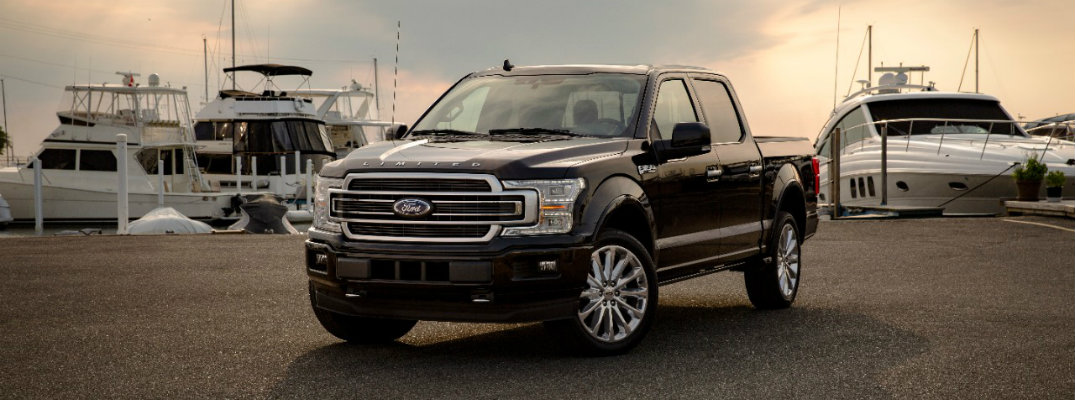 2019 Ford F-150 Limited parked in front of boats at marina