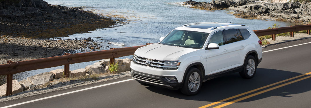 Driver side exterior view of a white 2018 VW Atlas