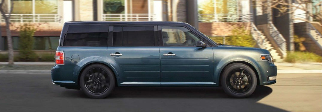 Passenger side exterior view of a blue 2019 Ford Flex