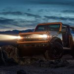 2021-Ford-Bronco-parked-in-desert-with-headlights-on_o-1