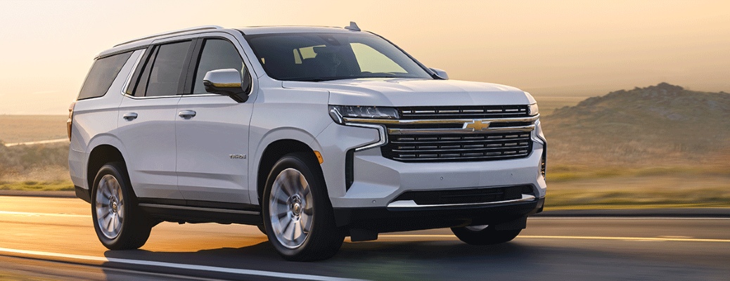 White 2021 Chevy Tahoe cruises on highway