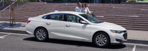 Front passenger angle of a white 2021 Chevrolet Malibu