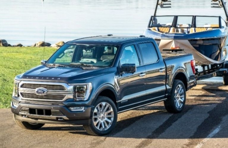 A 2021 Ford F-150 towing a boat