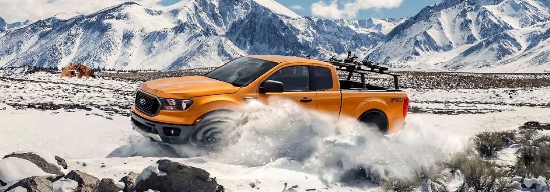 A 2021 Ford Ranger driving on snowy terrain.