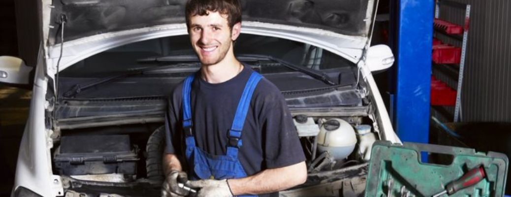 Mechanic posing with tools