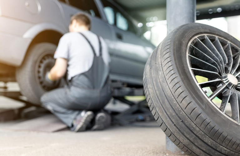 A mechanic inspecting a tire