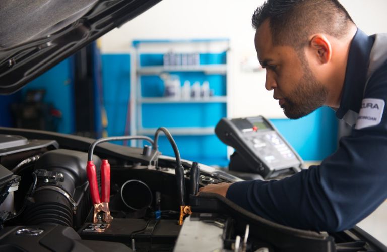  A mechanic checking the battery of a vehicle