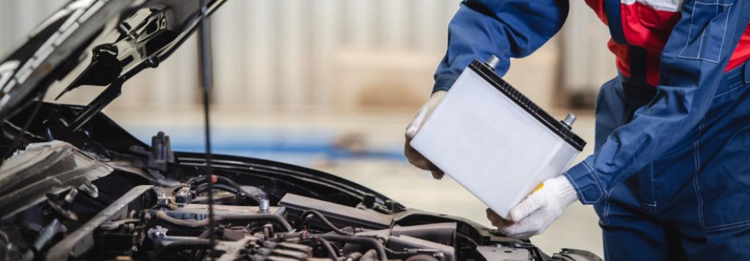 Hands of a man changing battery