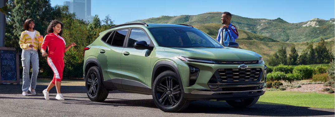 Several people standing behind the 2026 Chevrolet Trax