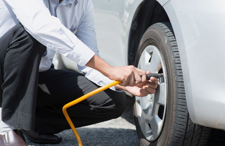 Hand of a man working on a vehicle