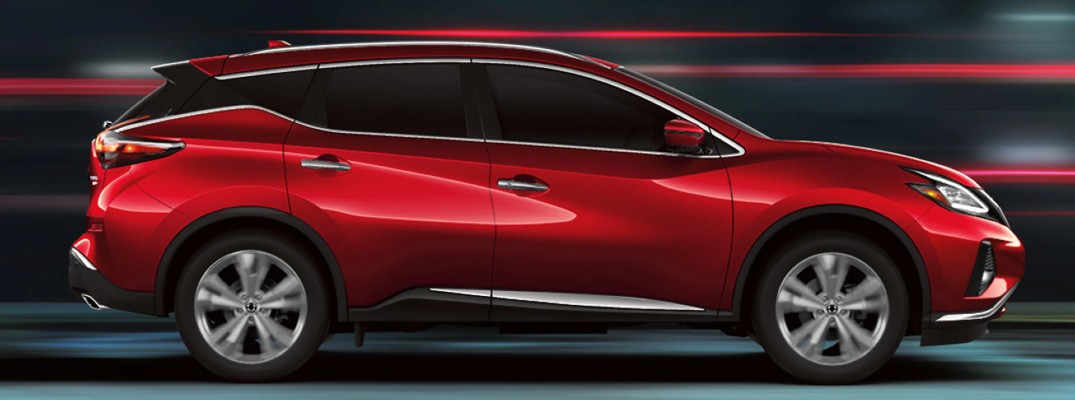 2020 Nissan Murano red paint facing right showing passenger doors surreal blurred background