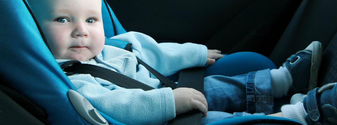 Baby sitting in a car seat