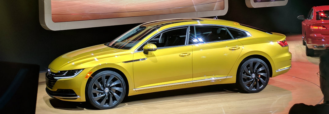 side view of the yellow 2019 Volkswagen Arteon at the 2018 Chicago Auto Show
