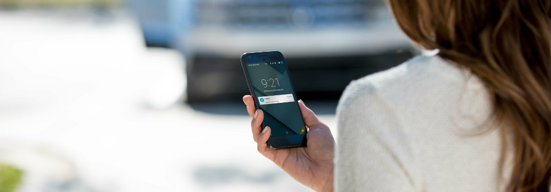 woman getting alerts via the Volkswagen Car-Net App
