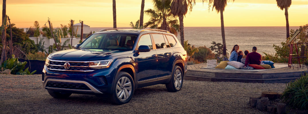 A left front quarter photo of the 2021 Volkswagen Atlas parked by the beach.
