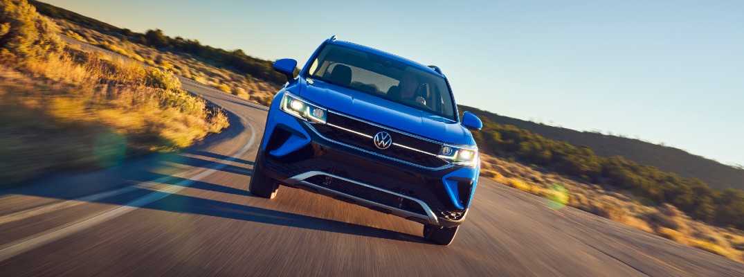 The 2022 Volkswagen Taos in motion on the road.