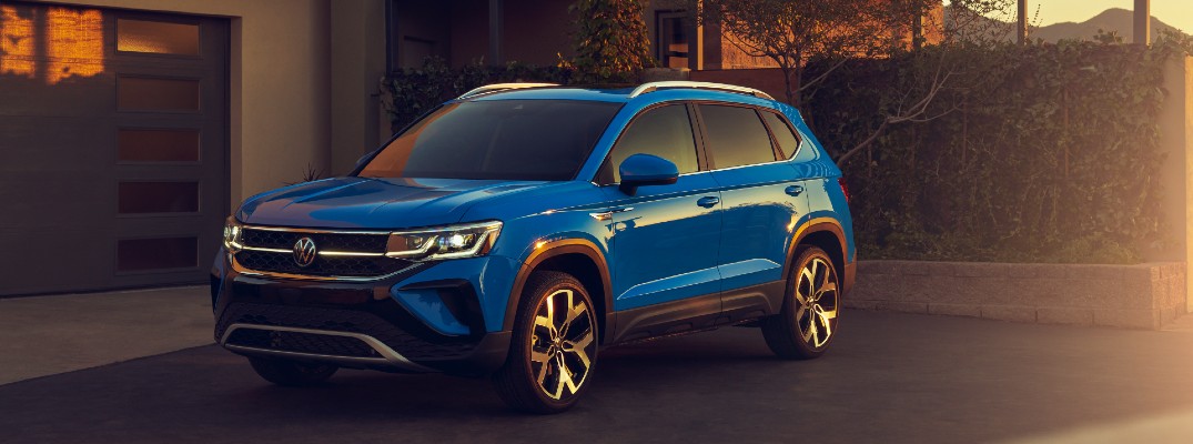 The 2021 Volkswagen Taos parked at a home.