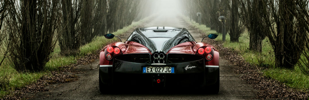 2018 Pagani Huayra Exterior Rear Fascia Driving Tree Lined Path