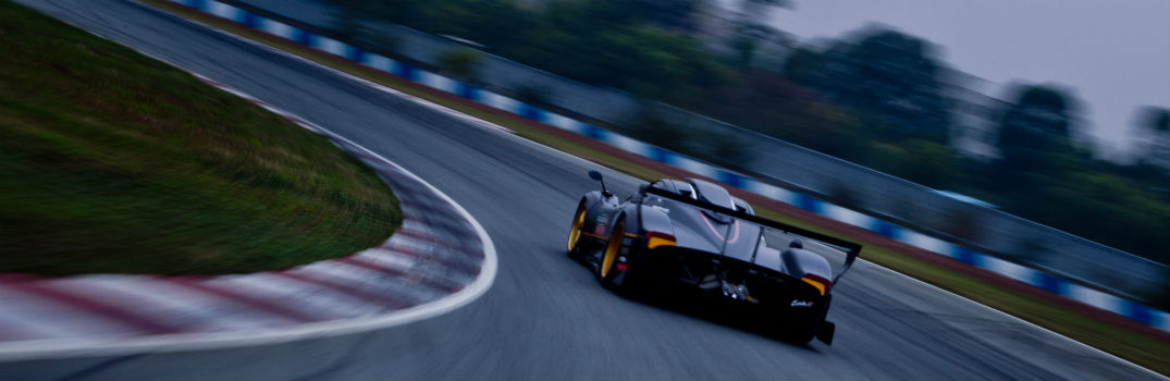 Pagani Zonda Exterior Driver Side Rear Angle on Track