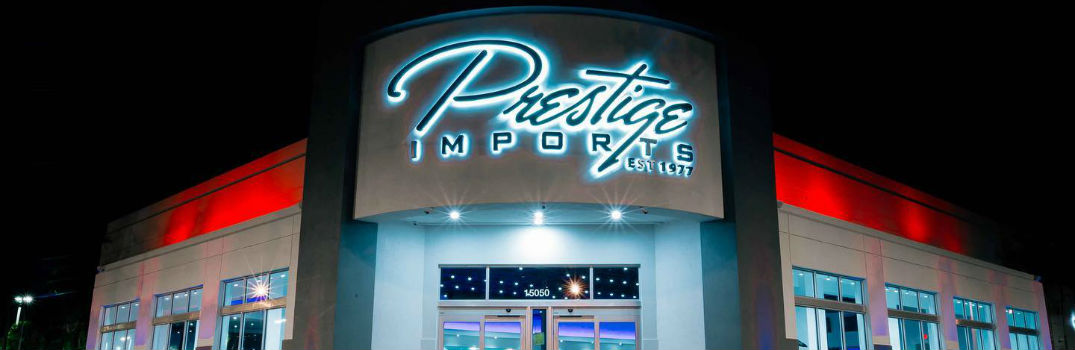 Prestige Imports Showroom Storefront at Night