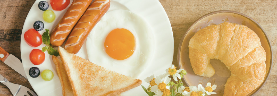 A large plate of breakfast foods