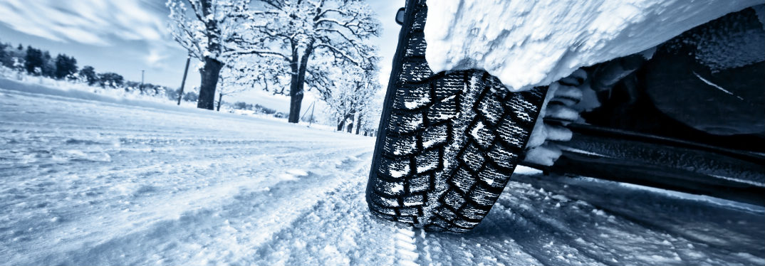 Close up of car tires on a snowy road