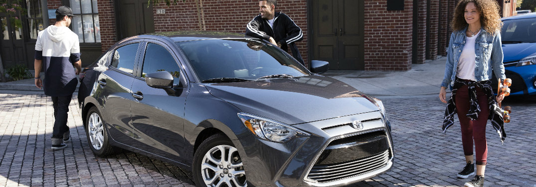 2018 Toyota Yaris iA parked on a cobblestone sidewalk