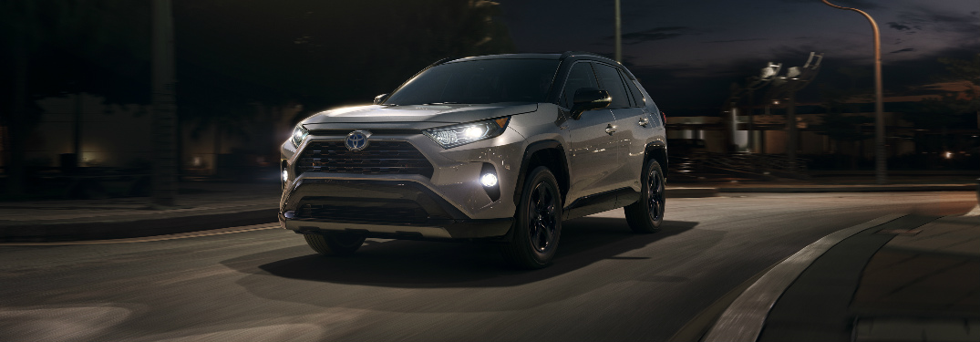 2019 Toyota RAV4 driving on an empty road at night