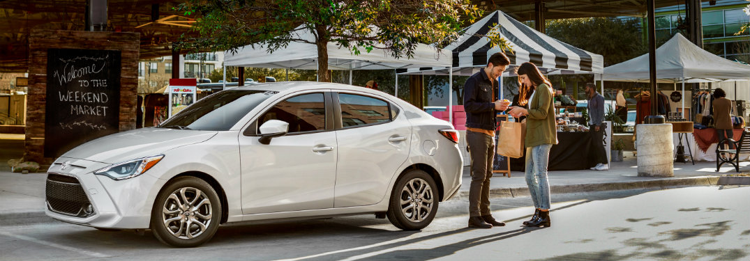 2019 Toyota Yaris Sedan parked at a weekend market