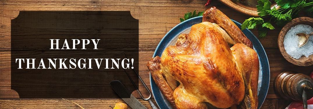 Turkey on a Table at Thanksgiving with Black Text Box and White Happy Thanksgiving! Text