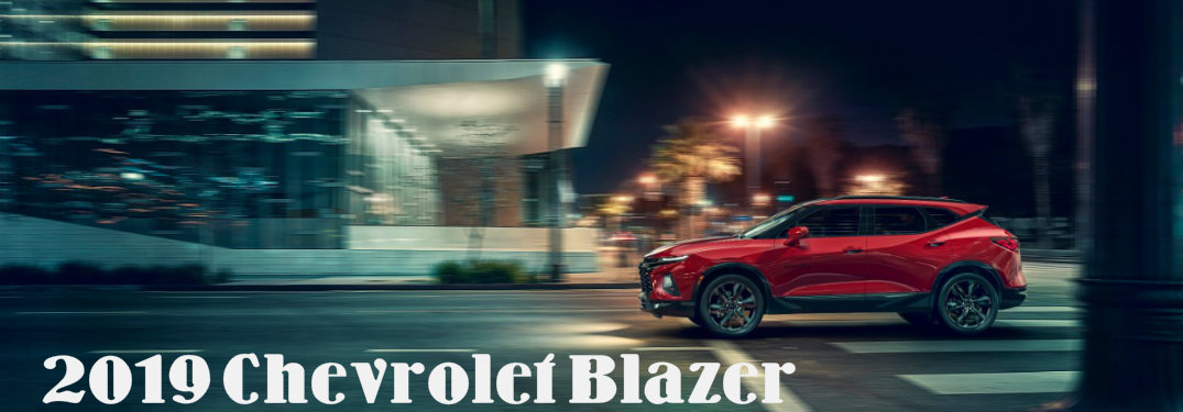 2019 Chevrolet Blazer side profile driving through city at night