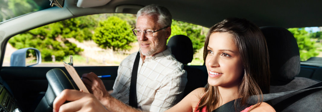 girl with drivers education instructor