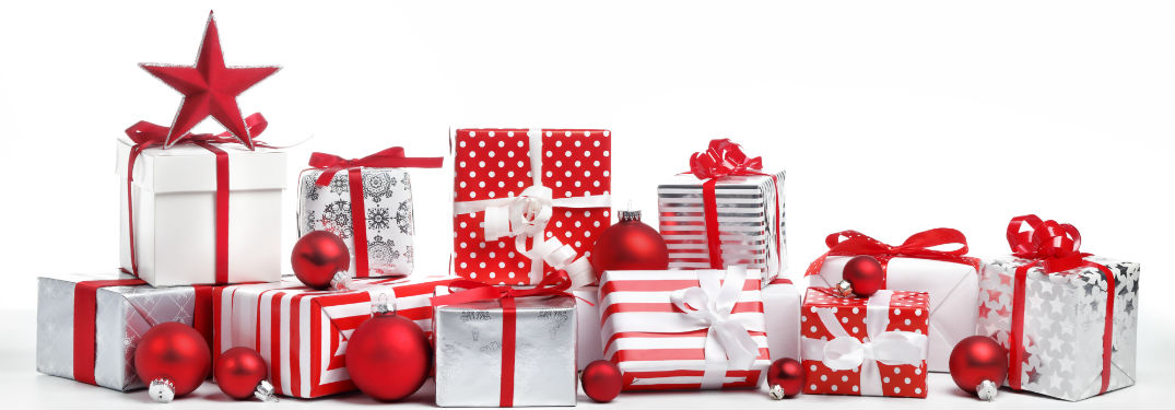 pile of red and white gifts with ornaments scattered throughout