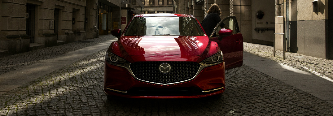 Woman Opening the Door of Red 2018 Mazda6