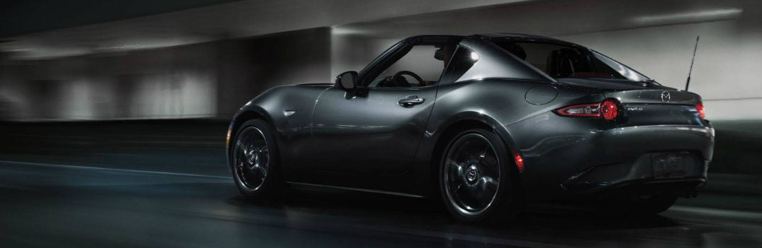 2018 Mazda MX-5 Miata black paint in tunnel with neon lights