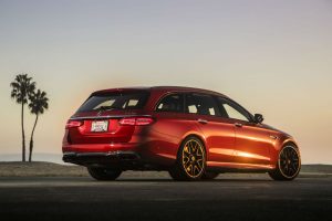 rear view of a red 2018 Mercedes-Benz E-Class Wagon parked near a beach