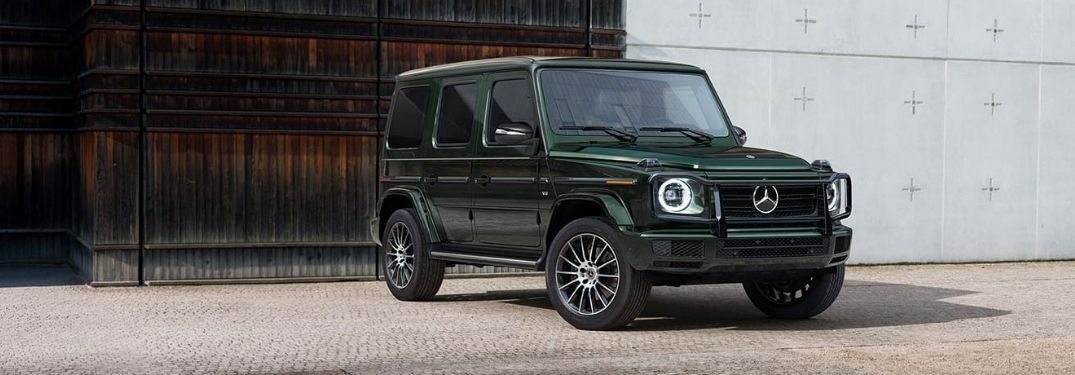 Green 2021 Mercedes-Benz G class AMG 63 parked infront a gate