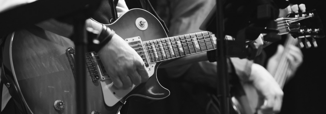 Closeup of a man playing guitar