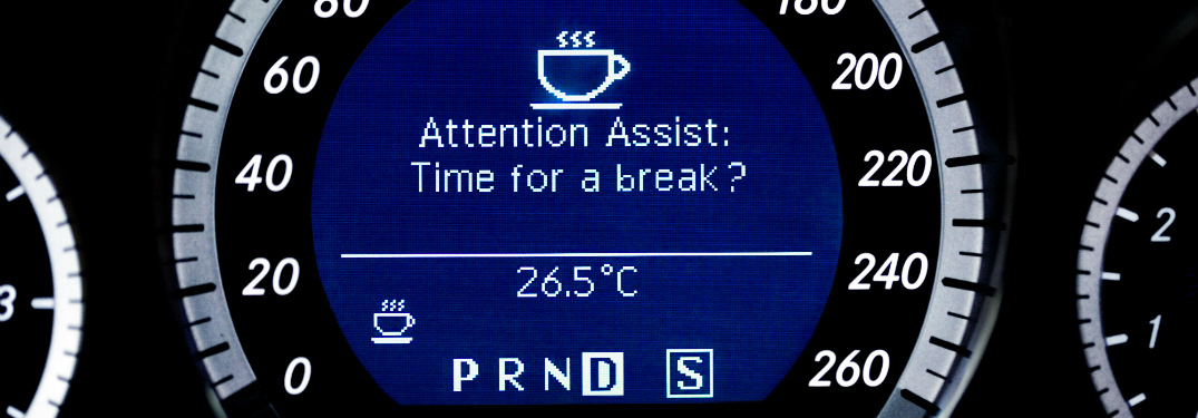 close up of speed gauge of mercedes-benz vehicle with attention assist warning