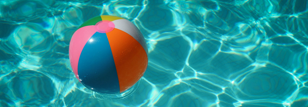 beach ball floating on water in swimming pool