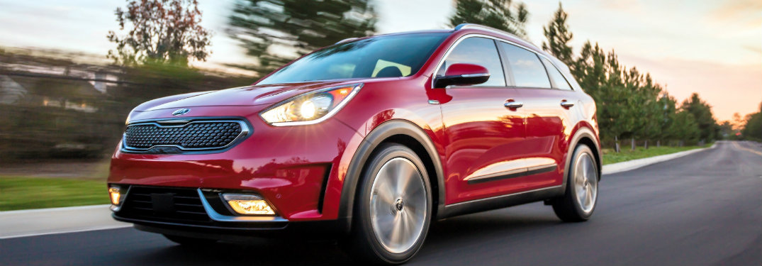 side view of a red 2018 Kia Niro