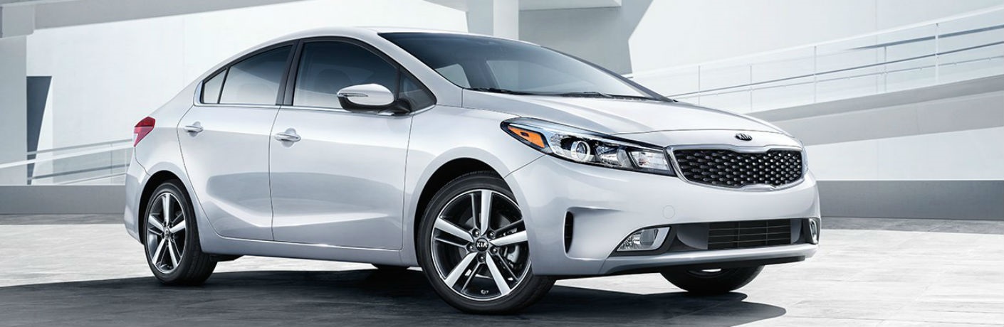 Side view of a white 2018 Kia Forte