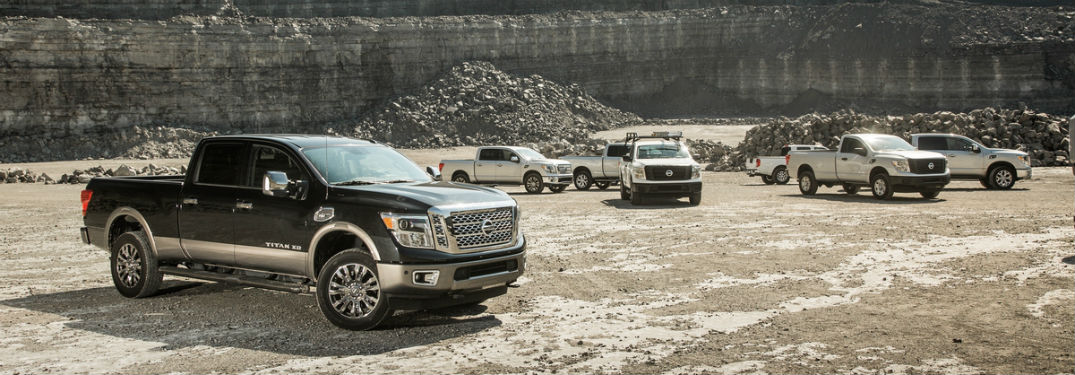 lineup of 2018 nissan titan and titan xd vehicles on stony job site