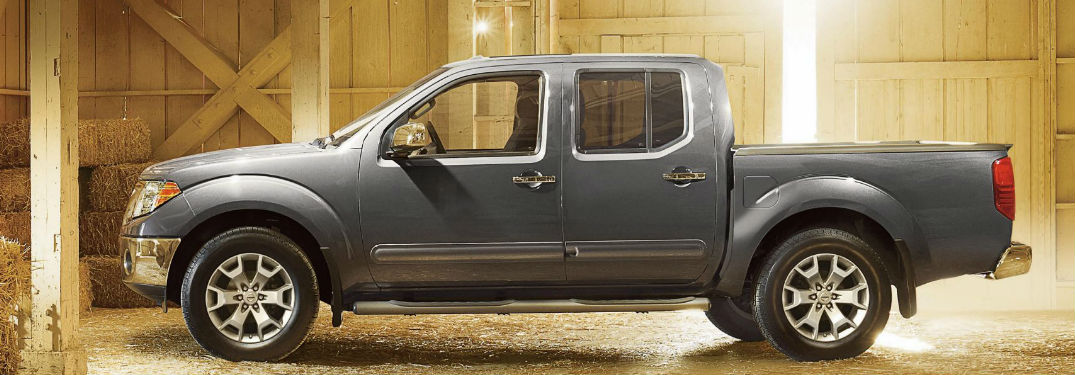 2018 Nissan Frontier parked in a barn showing side profile