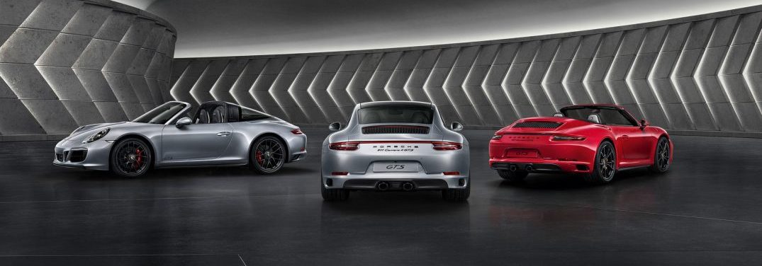 view of three 2018 Porsche 911 Carrara GTS Cabriolet parked near each other