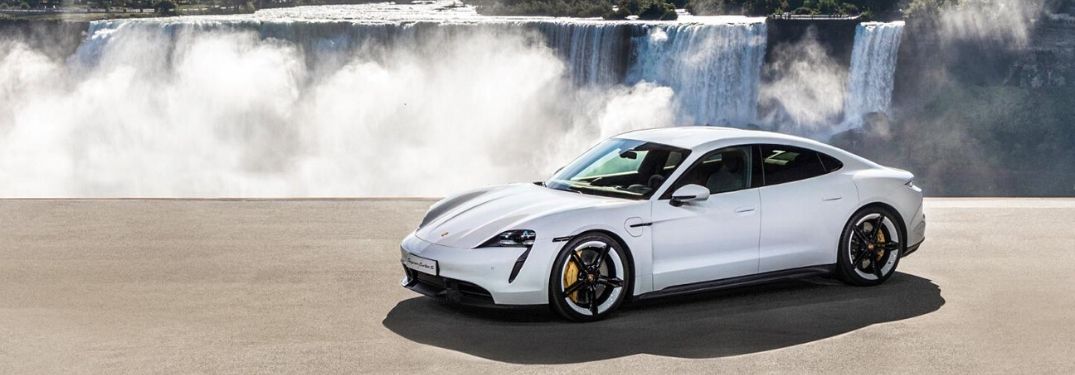 2019 Porsche Taycan in front of water fall